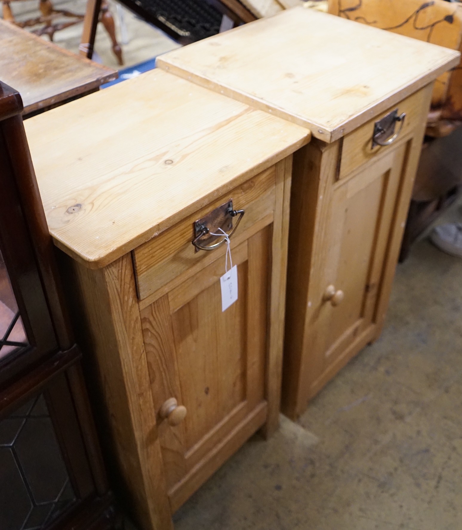 A near pair of 19th century continental pine bedside cabinets, larger width 40cm, depth 38cm, height 76cm